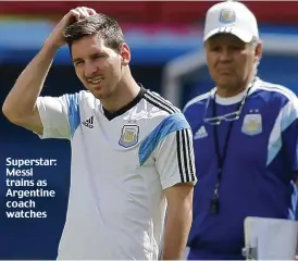  ??  ?? Superstar: Messi trains as Argentine coach watches