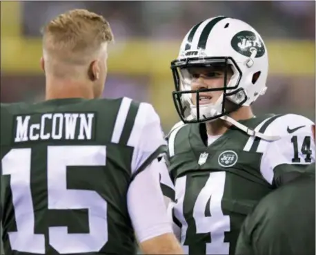  ?? AP PHOTO/BILL KOSTROUN, FILE ?? Sam Darnold (14) talks with Josh McCown (15) during a preseason game. Darnold won the Jets’ QB job.