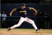  ?? RINGO H.W. CHIU — THE ASSOCIATED PRESS ?? Michigan’s Jeff Criswell pitches to a UCLA batter during the ninth inning of an NCAA college baseball tournament super regional game in Los Angeles on June 7, 2019.