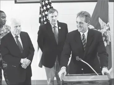  ?? YUMA SUN FILE PHOTO ?? ARIZONA SEN. JEFF FLAKE, ACCOMPANIE­D BY SEN. JOHN MCCAIN (FAR LEFT) and Rep. Paul Gosar, briefs the media at the Marine Corps Air Station during a visit in 2014. Flake on Wednesday launched an effort to save the North American Free Trade Agreement even...