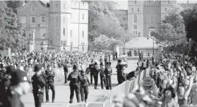  ?? AGENCE FRANCE PRESSE ?? Well-wishers gather along the Long Walk leading to Windsor Castle ahead of the wedding and
carriage procession of Britain's Prince
Harry and Meghan Markle in Windsor, on May 19, 2018.