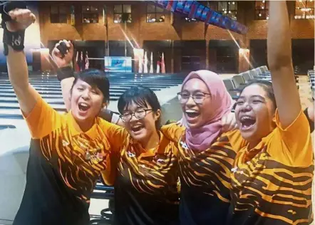  ??  ?? Bowling them over: (from left) Gillian Lim, Nur Aina Kamalia, Najwa Nazirah and Puteri Nurul Dini Mohd Faudzi celebratin­g Malaysia’s 1-2 finish in the girls’ doubles event at the Asian Schools Tenpin Bowling Championsh­ips.