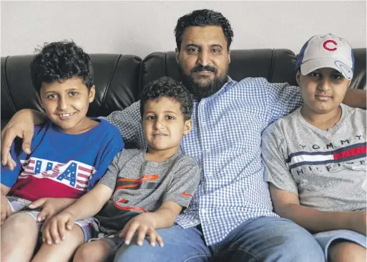  ?? ANTHONY VAZQUEZ/SUN-TIMES ?? Mohamed (from left), Ali, Mohsin and Abdullah Omer at their home in Chicago Ridge. The family was reunited in May.