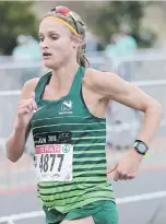  ??  ?? REMARKABLE. Van Zyl running earlier this year while carrying her second child.