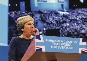  ?? RUI VIEIRA / ASSOCIATED PRESS ?? Conservati­ve Party Leader and Prime Minister Theresa May coughs during her address to delegates at the Conservati­ve Party Conference in Manchester, England, Wednesday.