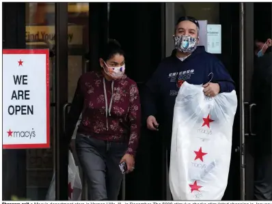  ?? (AP) ?? Shoppers exit a Macy’s department store in Vernon Hills, Ill., in December. The $600 stimulus checks stimulated shopping in January. Retail sales rose a seasonally adjusted 5.3% in January from the month before, the U.S. Commerce Department said Wednesday.