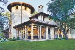 ??  ?? The Santa Barbara-inspired home in Denver’s Polo Club neighborho­od was designed to maintain existing trees.