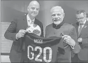  ?? —Twitter ?? PM Narendra Modi receives a football jersey from FIFA president Gianni Infantino during the G20 Summit.