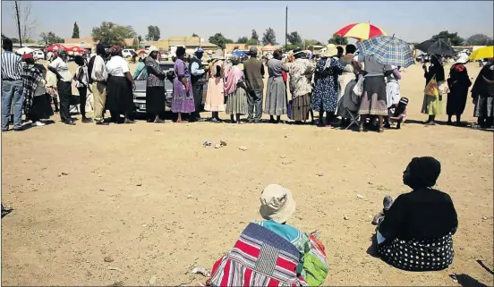  ?? PHOTO: THULANI MBELE ?? Pensioners in this file picture wait in queue at a SA Social Security Agency paypoint in Moloto, Kwa-Mhlanga, Mpumalanga. Sassa admits they are between a rock and a hard place when it comes to current contract to disburse grants.