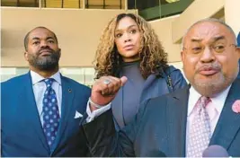  ?? KENNETH K. LAM/BALTIMORE ?? Defense lawyer A. Scott Bolton, right, claims his client Marilyn Mosby, center, is innocent after leaving federal court with her and her husband, Nick Mosby.