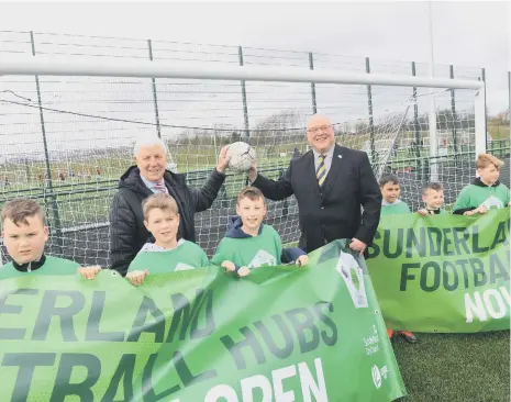  ??  ?? The Downhill Football Hub opens with SAFC Legend Jimmy Montgomery, council leader Coun Graeme Miller, with youngsters from I Am Sport.