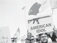  ?? Celia Talbot Tobin / New York Times ?? Protesters in El Paso at a rally to protest President Donald Trump’s visit. Trump and Senate Majority Leader Mitch McConnell have signaled a willingnes­s to consider background checks on gun purchases.