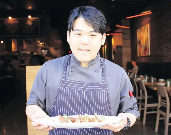  ??  ?? Gyoza Bar head chef Woo Jin’s prework ritual includes listening to Led Zeppelin’s Whole Lotta Love