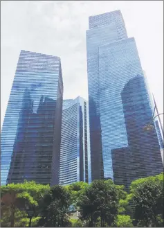  ??  ?? Photo shows tower blocks in Singapore.