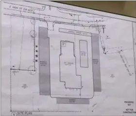  ?? EVAN BRANDT — DIGITAL FIRST MEDIA ?? The proposed site plan for the former car dealership on East High Street, located at the top of this map, calls for four buildings in addition to the existing building, which would be converted to climate-controlled self-storage and the office.