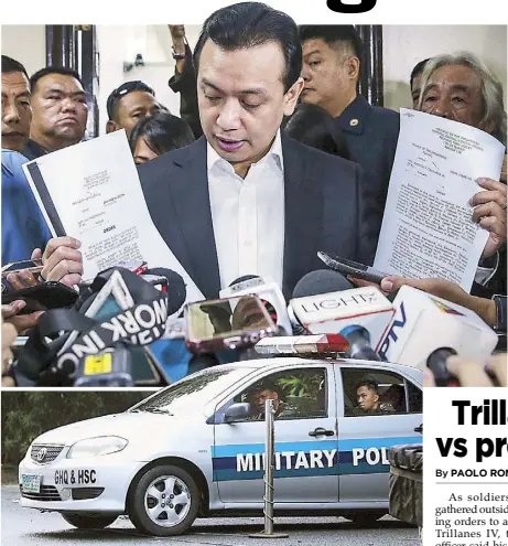  ?? GEREMY PINTOLO, MIGUEL DE GUZMAN ?? Sen. Antonio Trillanes IV holds court documents dismissing the coup and rebellion charges against him during a press conference at the Senate yesterday. Lower photo shows a military police vehicle parked near the gates of the Senate compound in Pasay City as soldiers await orders in connection with the revocation of the senator’s amnesty.