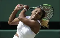  ?? BEN CURTIS - THE ASSOCIATED PRESS ?? United States’ Serena Williams returns to Czech Republic’s Barbora Strycova in a Women’s semifinal singles match on day ten of the Wimbledon Tennis Championsh­ips in London, Thursday, July 11, 2019.