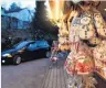  ?? PHOTO: REUTERS ?? Safe and festive . . . A car drives past a booth with sweets at a drivein Christmas market in Landshut, Germany.