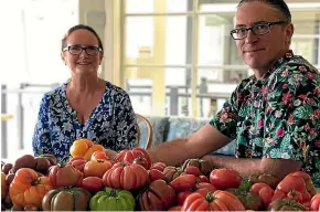  ??  ?? Angela and Anthony Tringham, owners of The Curious Croppers, grow heritage tomatoes.