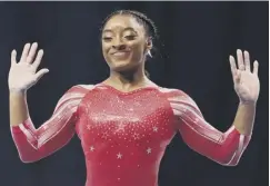  ??  ?? 0 Teenage twins Jessica (in action above left) and Jennifer Gadirova, main image, are in awe of US superstar Simone Biles, above right