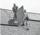  ?? THE BURLINGTON FREE PRESS ?? Installing solar panels in Shelburne, Vt., last year.