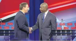  ?? CHRIS O’MEARA/AP ?? A new poll shows Republican gubernator­ial nominee Ron DeSantis, left, at a Sunday debate, trailing Democratic gubernator­ial nominee Andrew Gillum, right, by six points.