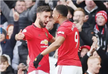  ?? Reuters ?? Manchester United’s Anthony Martial and Bruno Fernandes celebrate scoring a goal during a Premier League match in Britain in March.