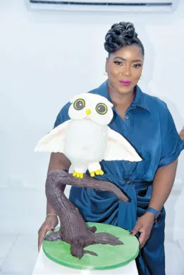  ?? ?? Exhibitor Rochelle Makyn proudly posing with her creation, ‘Owl on a Branch’.