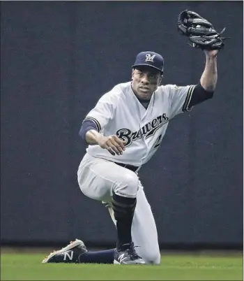  ?? Aaron Gash Associated Press ?? EX-DODGER Curtis Granderson, now primarily a pinch-hitter for the Milwaukee Brewers, says he would like to see more African Americans playing baseball, whether it be in college or in the pros.