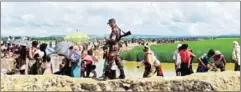  ?? MUNIR UZ ZAMAN/AFP ?? A Bangladesh border guard walks among Rohingya refugees near Ukhia, yesterday.