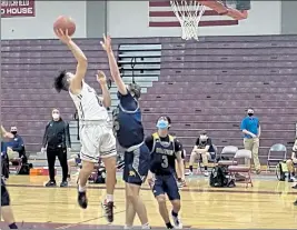  ?? NICK MALLARD / SENTINEL & ENTERPRISE ?? Fitchburg’s Gabriel Rivera shoots over Quabbin Regional’s Shea Skowyra on Thursday.