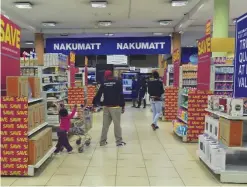  ??  ?? NAIROBI: Customers shop in a Nakumatt supermarke­t in Nairobi yesterday. Once a Kenyan success story, homegrown Nakumatt supermarke­ts were grappling with product shortages so severe even the country’s best-known cartoonist has taken notice, lampooning...