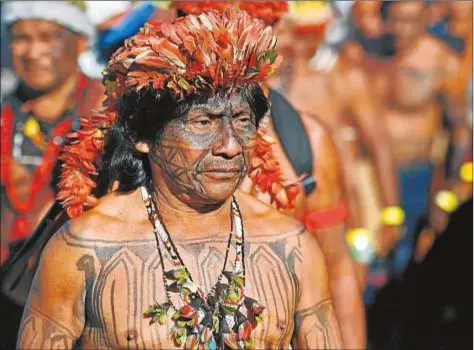  ?? AFP Photo ?? Miembros de la tribu Munduruku en Brasilia (Brasil)