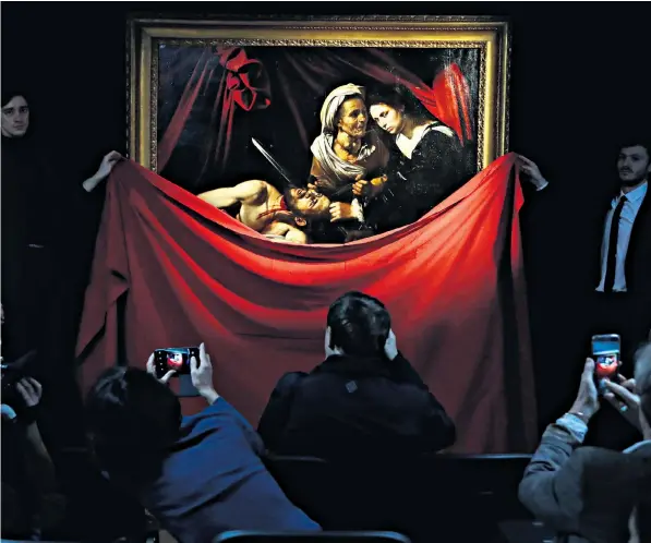  ??  ?? The disputed Caravaggio, which was found in a rundown farmhouse, is unveiled yesterday at the Colnaghi gallery in London, where it will be on display until next week before being auctioned in France later in the year