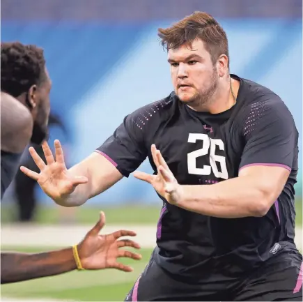  ?? JOE ROBBINS/GETTY IMAGES ?? Quenton Nelson has ideal size and strength and a reputation of finishing blocks with nastiness.