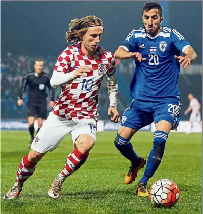  ??  ?? Made of sterner stuff: Adversity has helped Croatia’s Luka Modric (left) to become the great player he is now. — AP