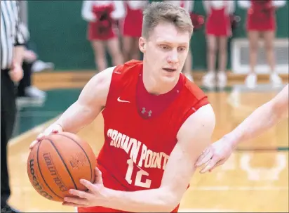  ?? MICHAEL GARD / POST-TRIBUNE ?? Crown Point’s Ty Smith drives against Chesterton during the Class 4A Valparaiso Sectional.