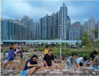  ?? — AP ?? average new home prices in China’s 70 major cities rose 0.9 per cent in november from a month earlier.