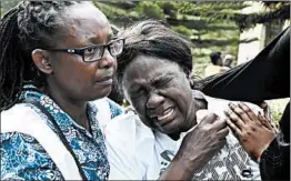  ?? SIMON MAINA/GETTY-AFP ?? A woman cries after identifyin­g the body of a relative Wednesday in Nairobi, Kenya, after a blast followed by a gun battle rocked a hotel and shopping complex.