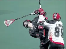  ?? GERRY KAHRMANN/POSTMEDIA NETWORK FILES ?? Calgary Roughnecks player Riley Loewen earned an elbowing penalty after checking Peterborou­gh’s Thomas Hoggarth of the Vancouver Stealth in National Lacrosse League action in Langley, B.C. on Jan. 14, 2017. Hoggarth was recently traded to the Buffalo...