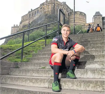  ??  ?? Jamie Ritchie at Edinburgh Castle sporting the capital club’s new kit