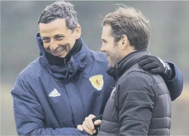  ?? ?? 0 Ex-hibs boss Jack Ross, who was delivering an SFA coaching course at the Oriam, shares a joke with Hearts manager Robbie Neilson when they met yesterday