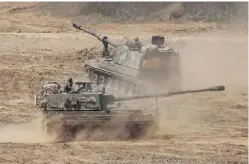  ??  ?? PAJU: South Korean Army K-9 self-propelled howitzers move during the annual exercise in Paju, South Korea, near the border with North Korea, yesterday. — AP