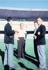  ??  ?? England captain Billy Wright inspects the pitch at the newly-opened Maracana Stadium in Rio De Janeiro