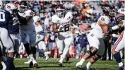  ?? BUTCH DILL AP ?? Texas A&M’s Isaiah Spiller needs 14 yards to become the third SEC running back to gain 1,000 yards this season.