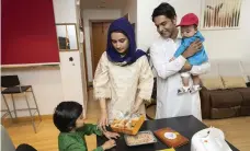  ?? Chris Whiteoak and Antonie Robertson / The National ?? Fruit is arranged at a shop in Deira, Dubai, in preparatio­n for people to stock up for gatherings at Eid Al Fitr; above, Javairia Hassan says her family will attend Eid prayers at the mosque