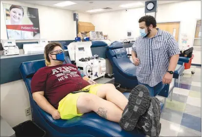  ?? PHOTOS BY STEVE MARCUS ?? Michael Morales donates plasma Thursday at CSL Plasma, 3220 S. Nellis Blvd. An industry spokespers­on said plasma donations are on the upswing as more people are vaccinated against the coronaviru­s and the usual winter slowdown comes to an end.