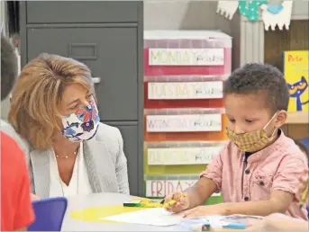  ?? Contribute­d, File ?? Gordon County Schools Superinten­dent Kimberly Fraker visits with a student during the first day of class in this August 2020 file photo.