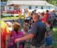  ??  ?? Campers, counselors, firefighte­rs and their families gather at the Variety Camp and Developmen­t Center in Worcester.