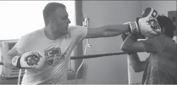  ??  ?? Nick Habscheid (at left) throws a head punch at Andrew Severs during a sparring round at the spar-a-thon, June 16.